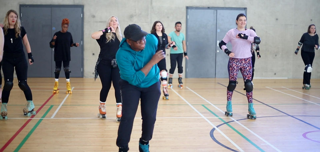 A roller skating instructor leads a class in Brixton, South London